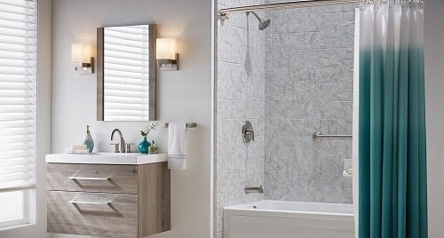 A beautiful white bathroom with a tub and shower bathing enclosure.