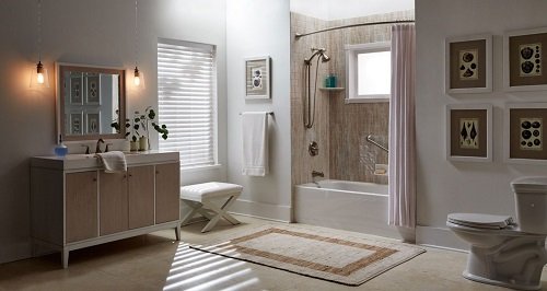A large master bathroom with a tub and shower combo, vanity, and mirror.